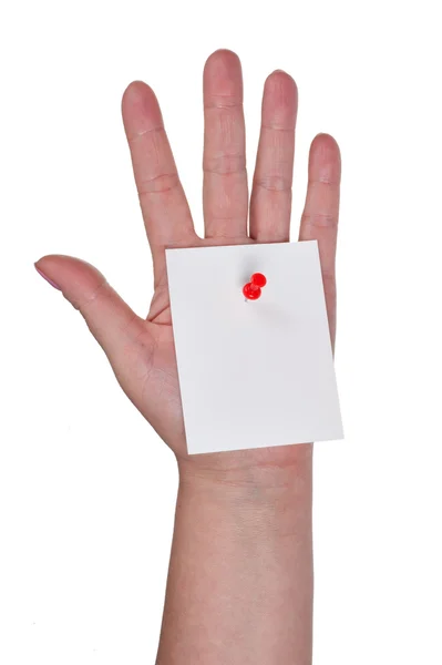 Folha de papel fixada a uma mão — Fotografia de Stock