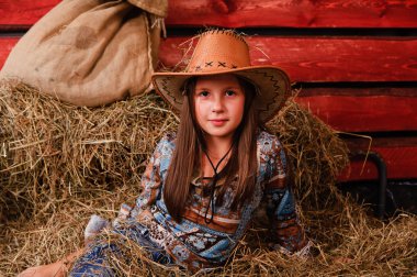 The little girl in a cowboy's hat clipart