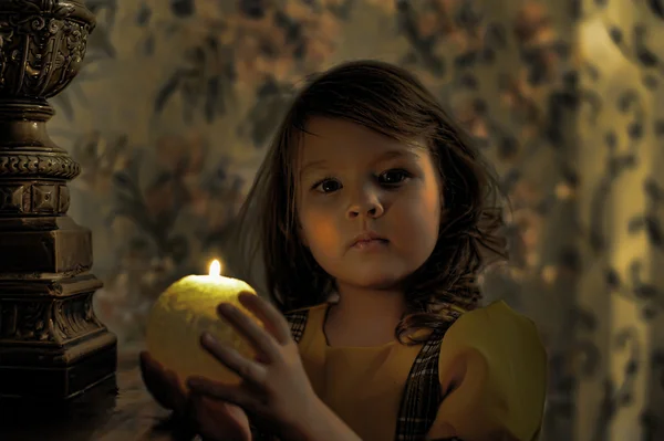 Candlelight portrait of beautiful little girl — Stock Photo, Image