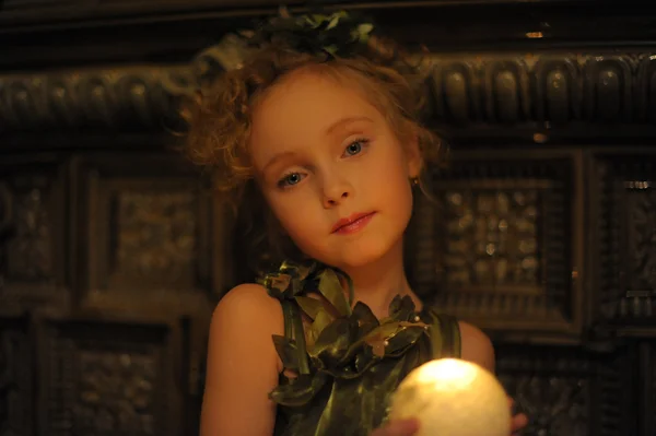Candlelight portrait of beautiful little girl — Stock Photo, Image