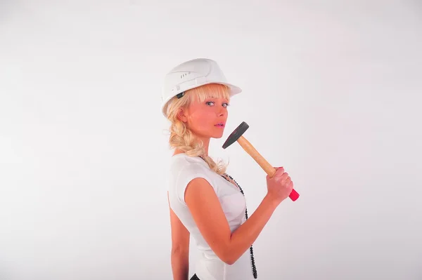 Young blond businesswoman, hammer helmet — Stock Photo, Image