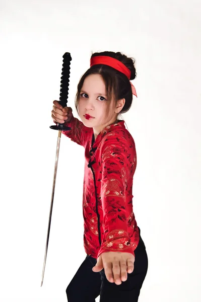 A girl handling a long samurai sword — Stock Photo, Image