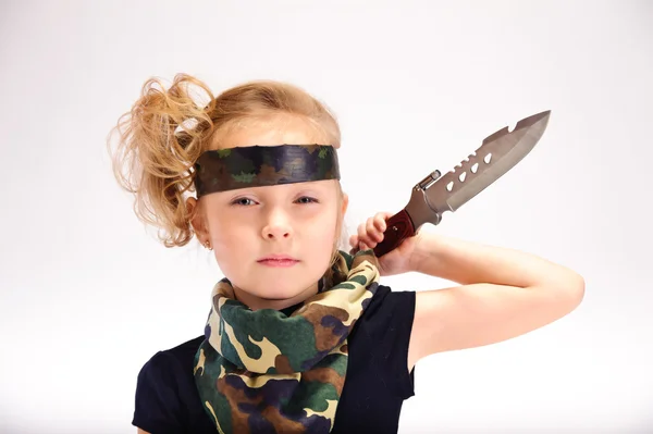 Toddler girl with an army knife — Stock Photo, Image