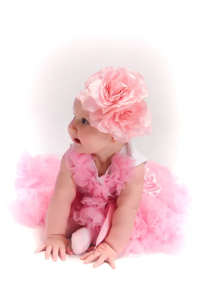 Baby girl wearing pettiskirt tutu and pearls crawling — Stock Photo, Image