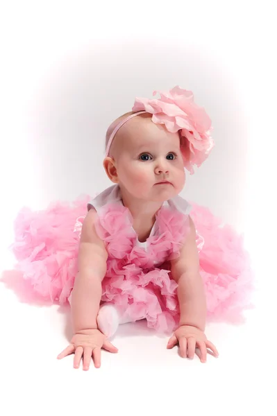 Baby girl wearing pettiskirt tutu and pearls crawling — Stock Photo, Image