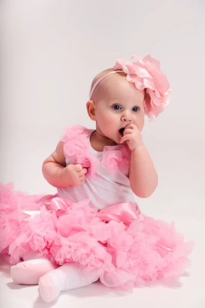 Baby girl wearing pettiskirt tutu and pearls crawling — Stock Photo, Image