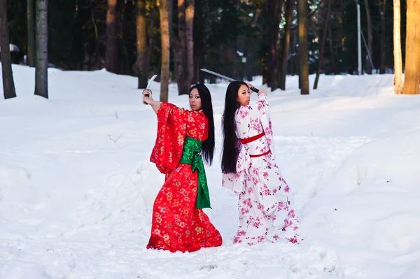 Beautiful brunette girls in a japanese kimono — Stock Photo, Image