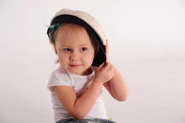 Little girl in a captain's cap — Stock Photo, Image