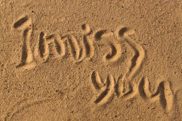 Worte auf Sand Stockbild