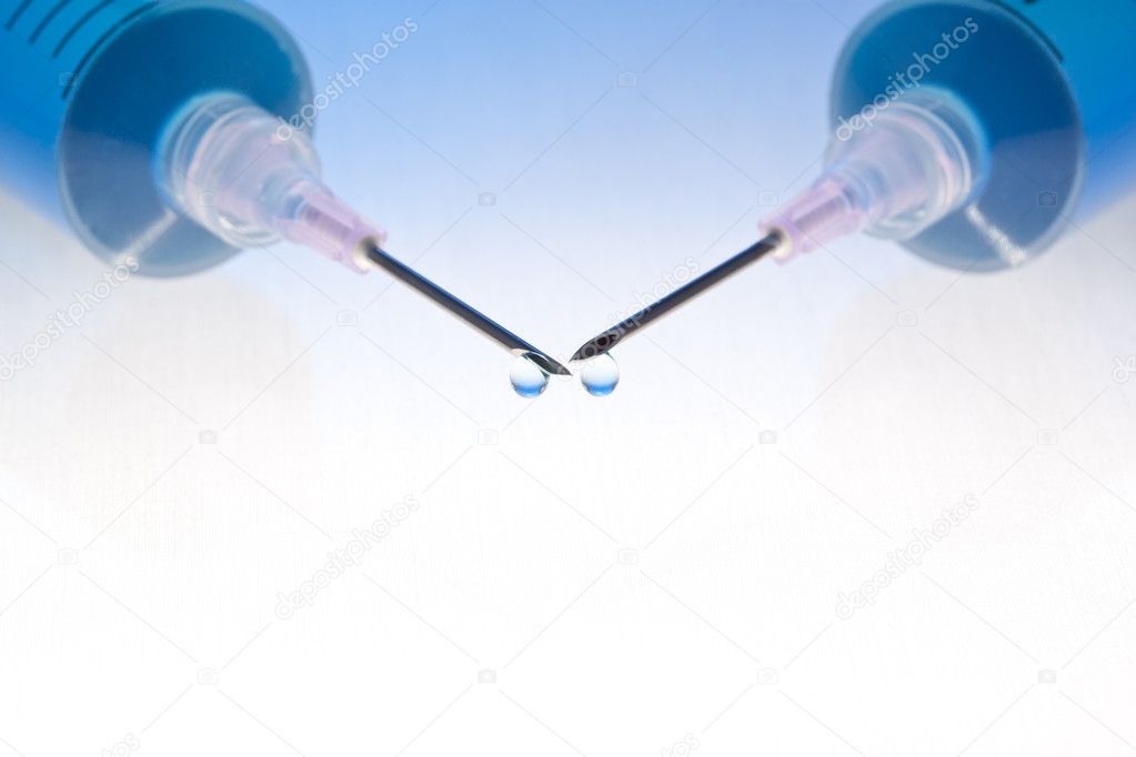 Blue medication with colorful background. Lit from below, blended blue-colored background.