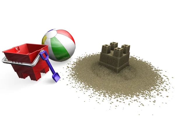Песчаный замок с пляжным мячом, ведром и лопатой — стоковое фото