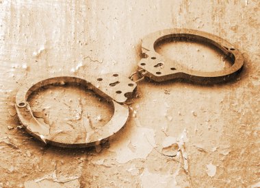 Handcuffs on grunge clipart