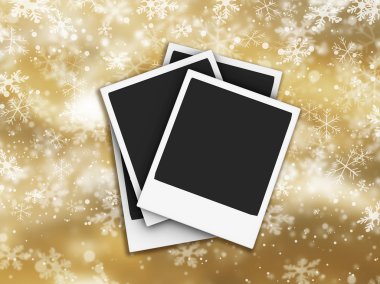 Polaroids on snowflake background clipart