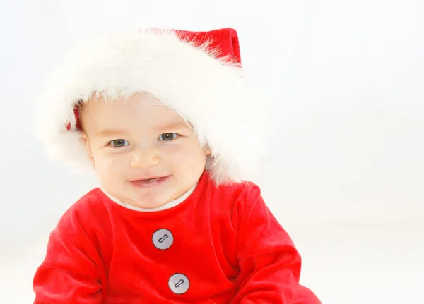 Gülen bebek çocuk Noel Baba kıyafeti — Stok fotoğraf