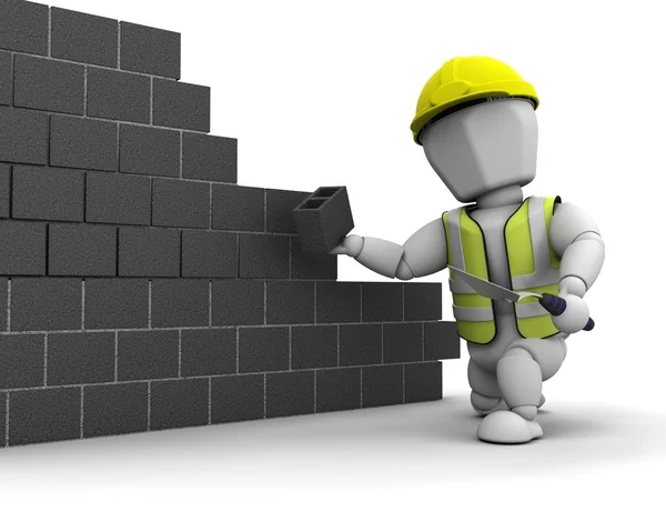 stock image Man laying blocks building a wall