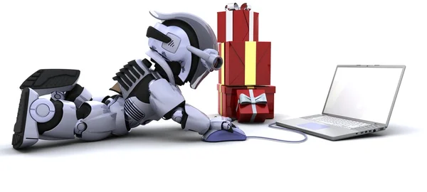 Робот купує подарунки на комп'ютері — стокове фото