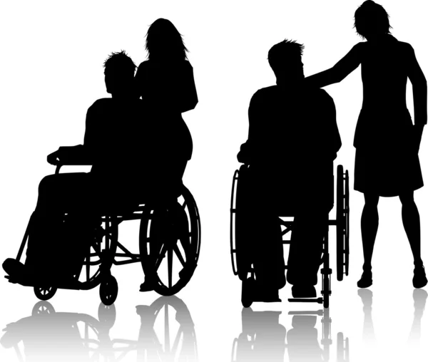 Мужчина в инвалидном кресле с женщиной — стоковое фото