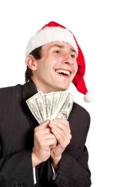 işadamı Noel Baba şapkası içinde para tutuyor