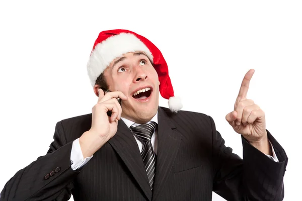 Młody biznesmen z telefonem w kapeluszu, santa — Zdjęcie stockowe