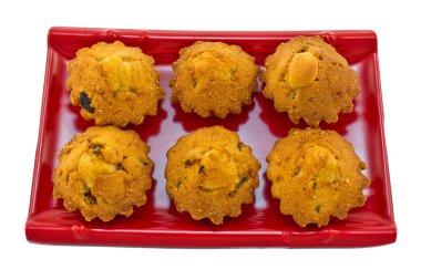Small cupcakes with raisins on a tray. clipart