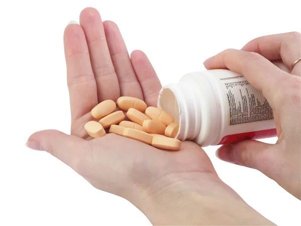 Viele Tabletten auf der Handfläche — Stockfoto