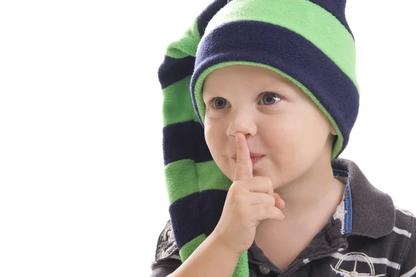 Child in a green cap on white background — Stock Photo, Image