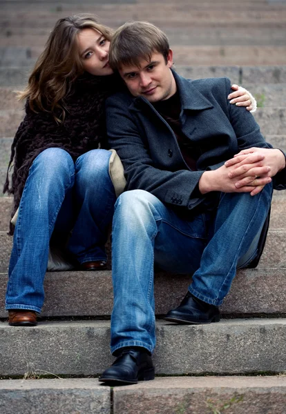 stock image A young tender couple sitting on a starways