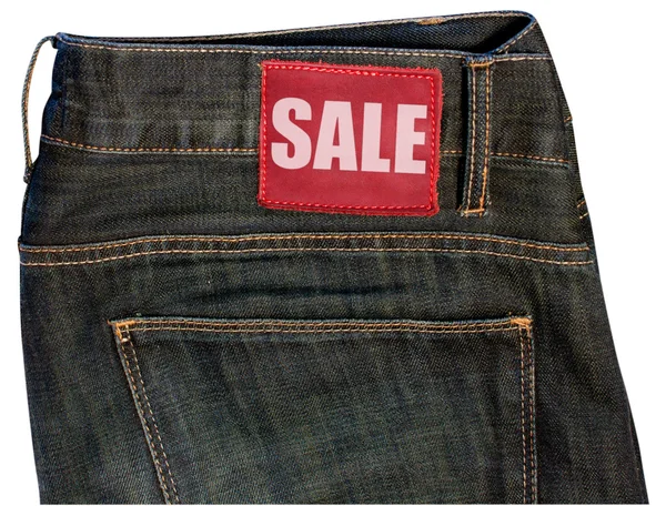 Jeans com sinal de venda — Fotografia de Stock