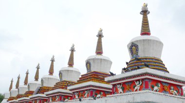 Landmarks of Tibetan stupa in a lamasery clipart
