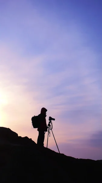 stock image Silhouette of a photographer at sunrise