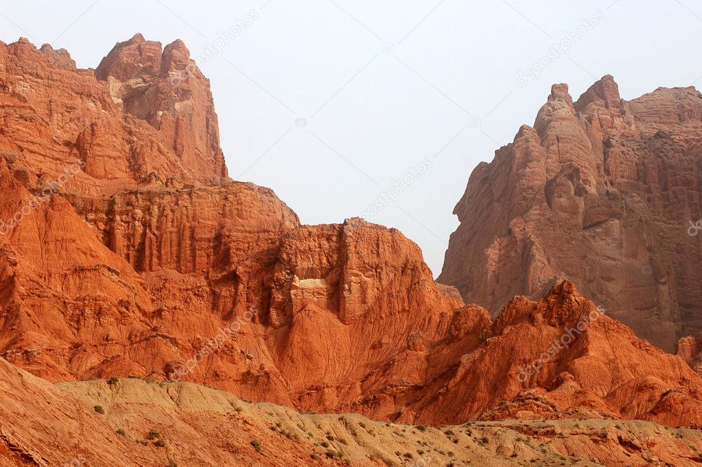 Landscape of red mountains at the entrance of a canyon