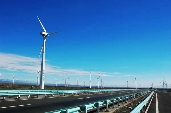 stock image Wind turbine generators in sinkiang,china,with blue skies and white clouds as backgrounds