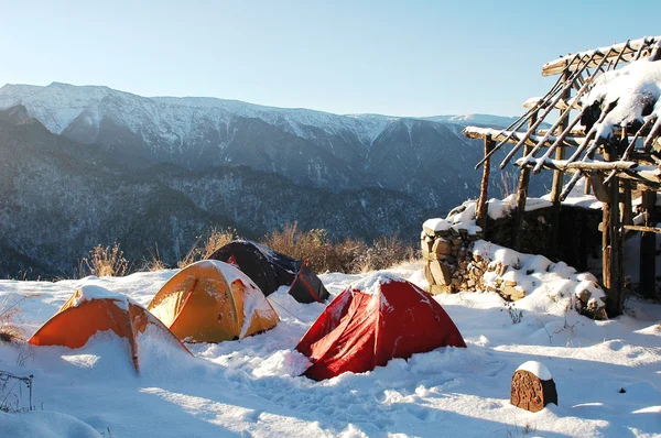 stock image Scenery of tents at a camp on the top of mountains in winter