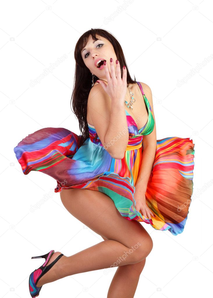 The beautiful girl in a fluttering dress isolated on a white bac