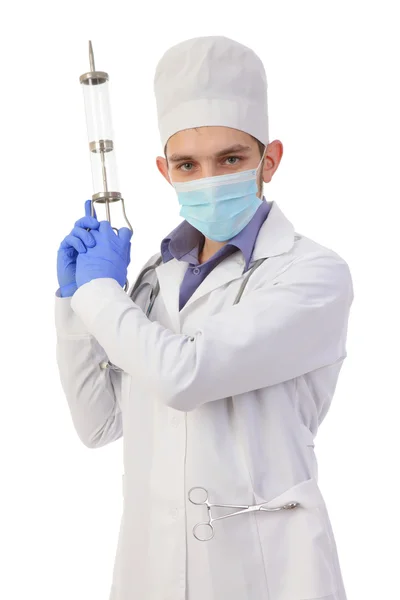 Dottore in una maschera con la siringa grande — Foto Stock