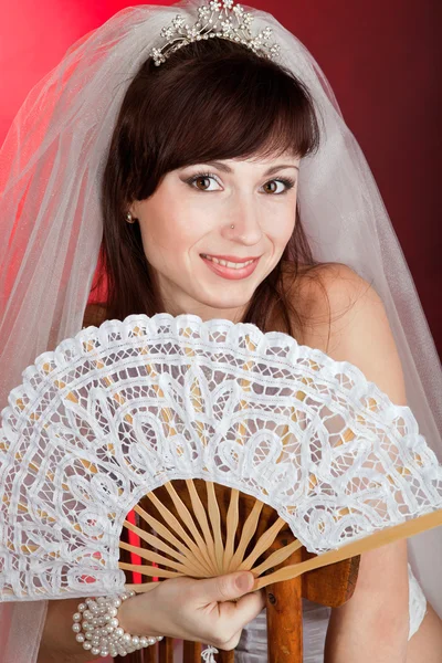 Bride with a fan — Stock Photo, Image