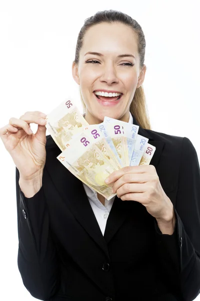 Молодая предпринимательница держит банкноты на белом фоне студии — стоковое фото