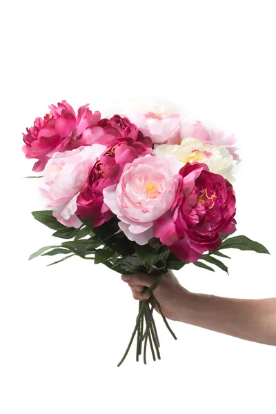 Hand holding a bunch of flowers — Stock Photo, Image