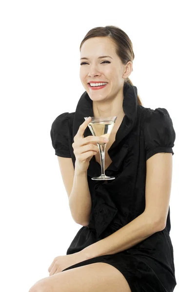 Elegant young woman drinking a cocktail on white background studio — Stock Photo, Image