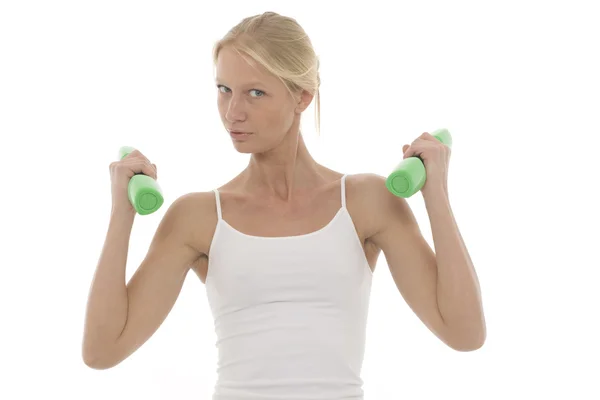 Portrait of a young caucasian woman who trains with dumbbells in hand — Stock Photo, Image