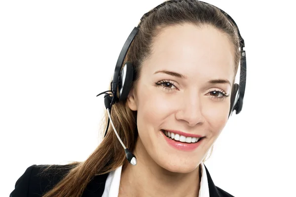 Young businesswoman with headset on white background studio — Stock Photo, Image
