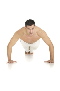 Bare-chested man does push-ups clipart