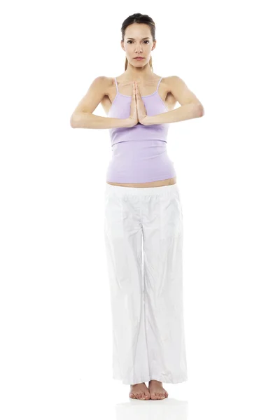 Young woman practicing yoga on white background studio — Stock Photo, Image