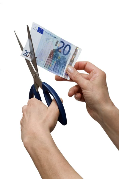 Hands cutting one banknote with scissors — Stock Photo, Image