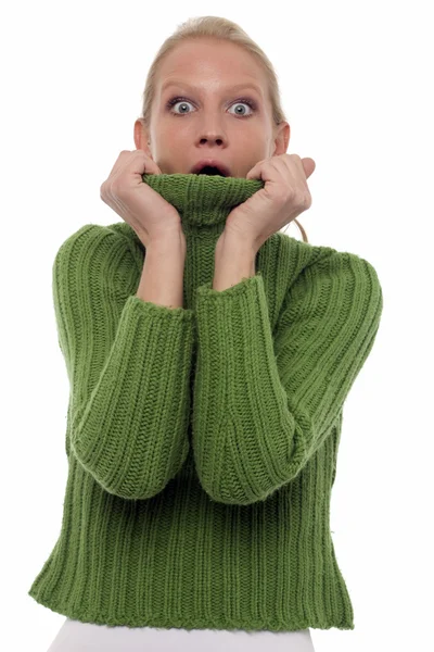 Portrait of a scared young caucasian woman with green turtleneck — Stock Photo, Image
