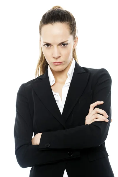 Severe businesswoman with arms crossed on white background studio — Stock Photo, Image