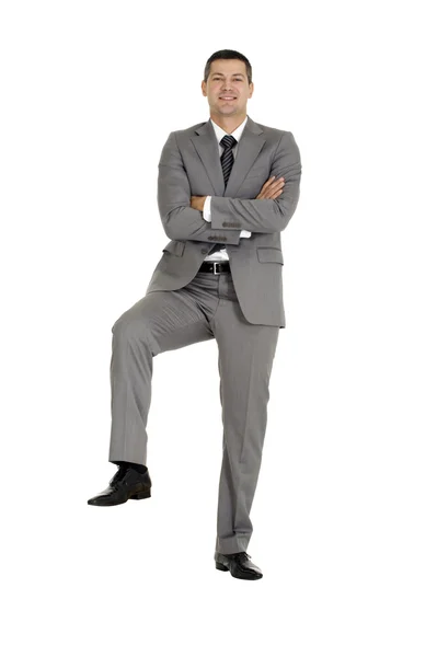 Uomo d'affari con un piede su un gradino — Foto Stock