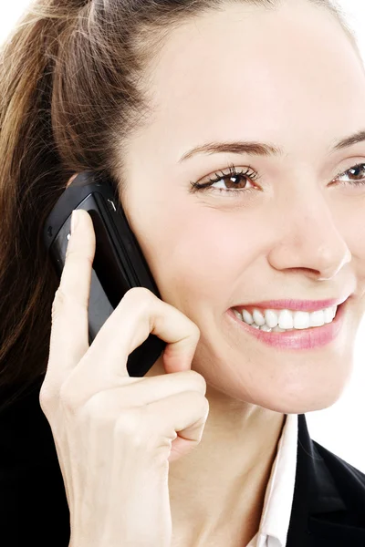 Junge Geschäftsfrau mit Handy auf weißem Hintergrund Studio — Stockfoto