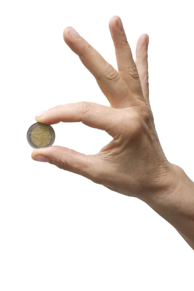 Jedna ręka trzyma monetę — Zdjęcie stockowe