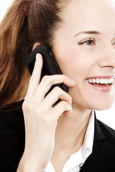 Giovane donna d'affari con cellulare su sfondo bianco studio — Foto Stock